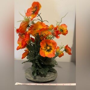 Vibrant Orange Floral Arrangement With Stone Holder